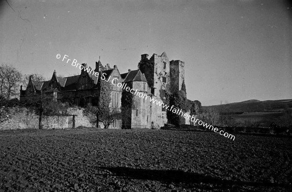 CARRICK CASTLE  VIEW FROM ORCHARD SHOWING OLD CASTLE AND ELIZABETHAN ADDITION